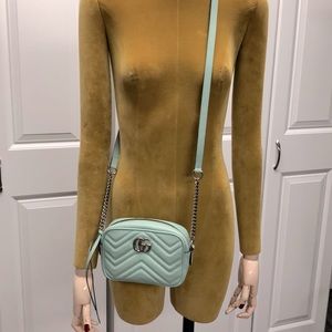Women’s Gucci Marmont mini camera crossbody bag.
